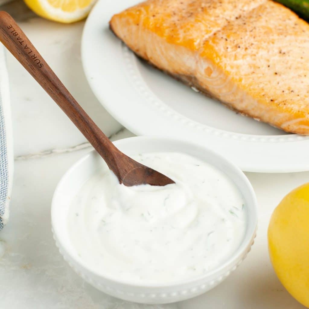 Bowl of dill dip and salmon.