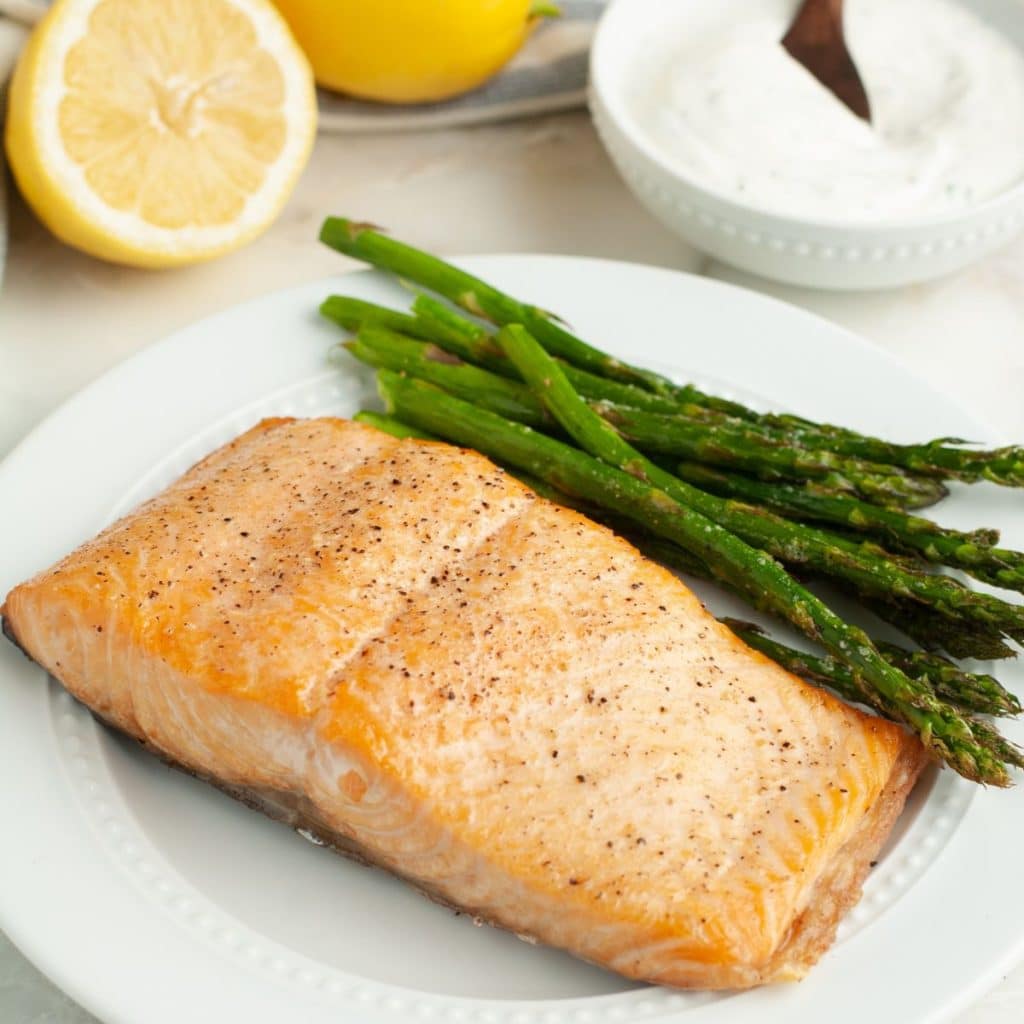 Salmon and asparagus on a plate. 