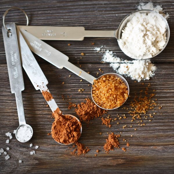 Measuring spoons with spices and flour.
