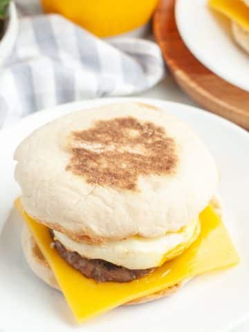 English muffin with sausage and cheese sandwich.
