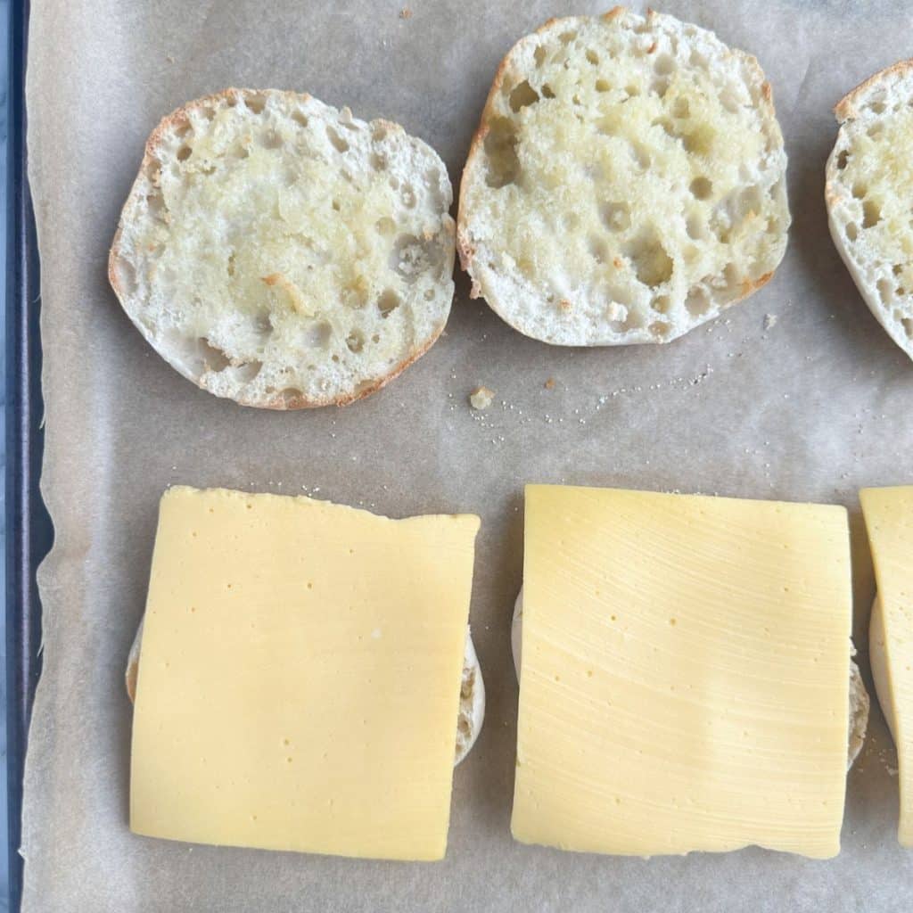 English muffin with a slice of cheese.