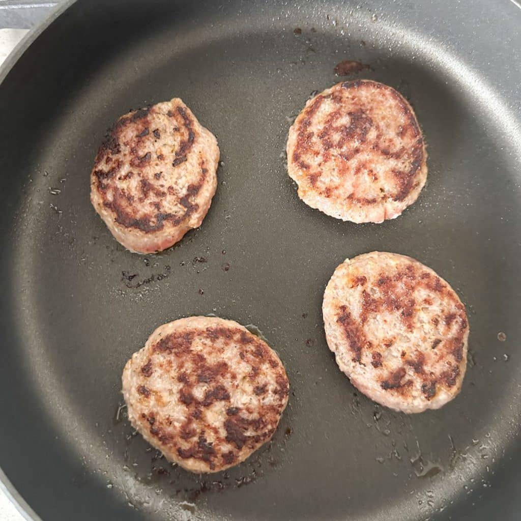 Sausage in a skillet. 