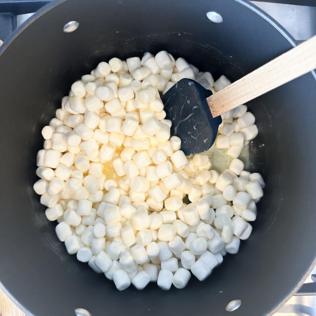 Pot with mini marshmallows, butter, and sweetened condensed milk.