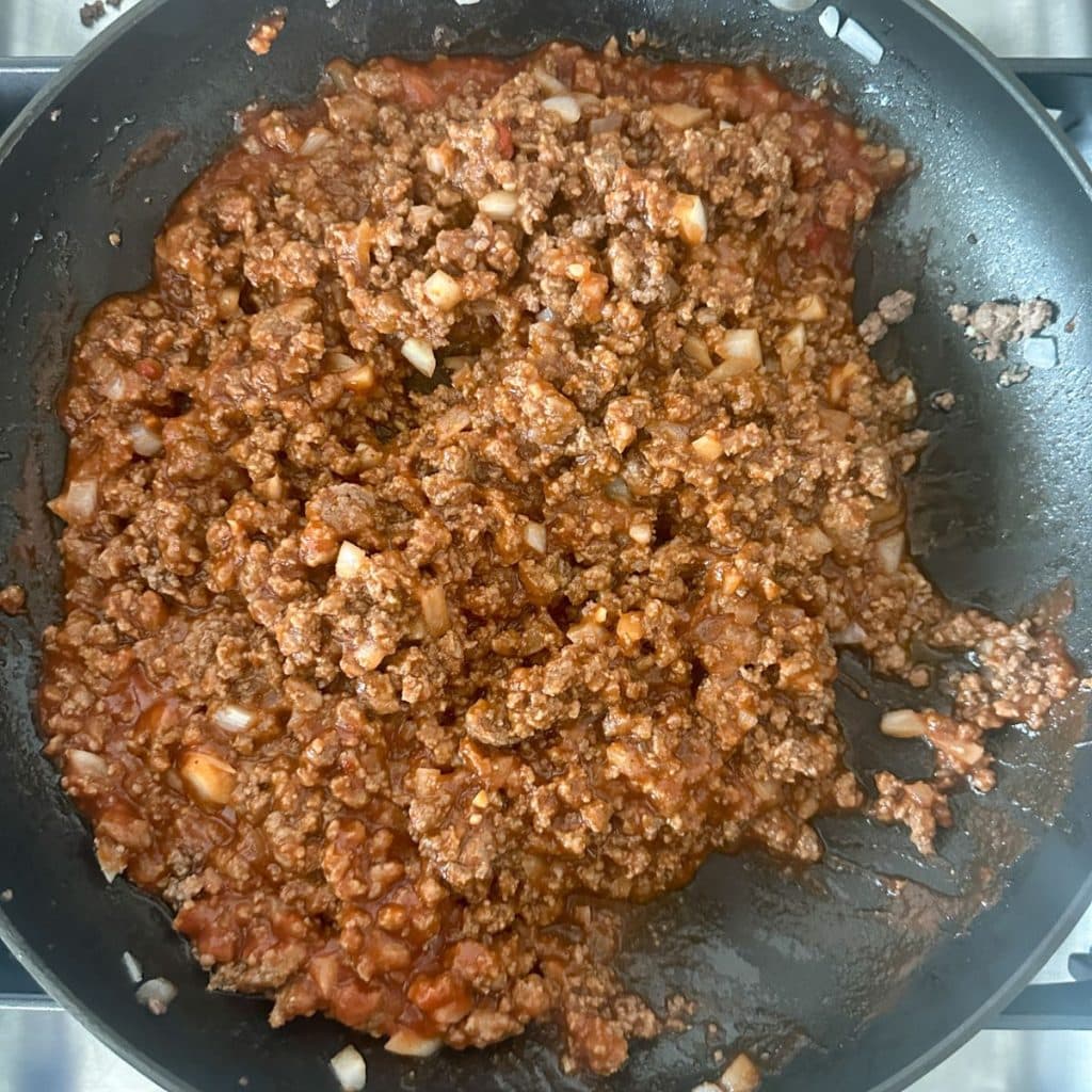 Skillet with cooked sloppy joe meat.