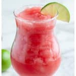 Glass with watermelon margarita.