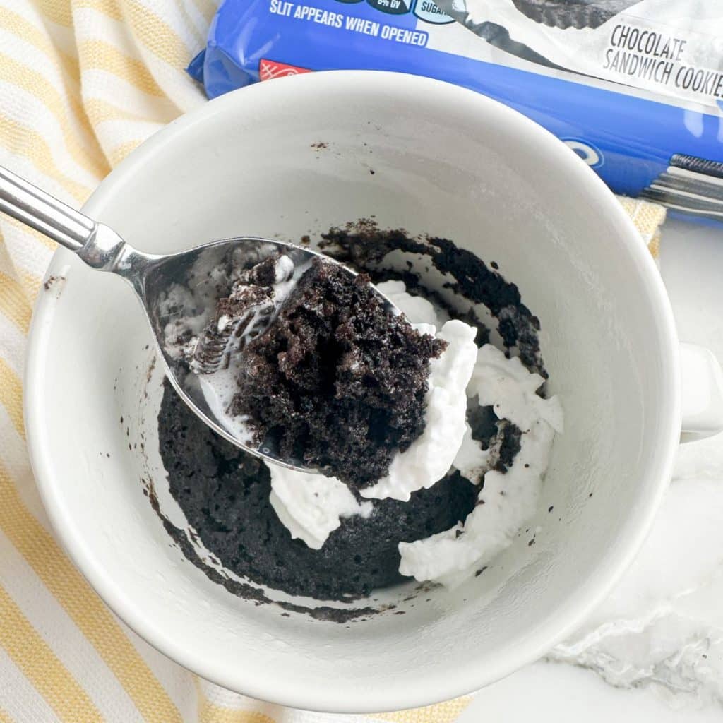 Chocolate cup with cream and a spoon. 