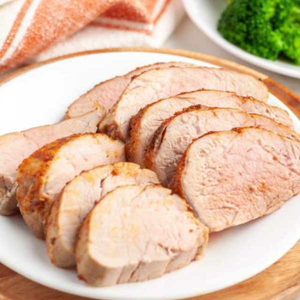 Sliced pork tenderloin on a plate.