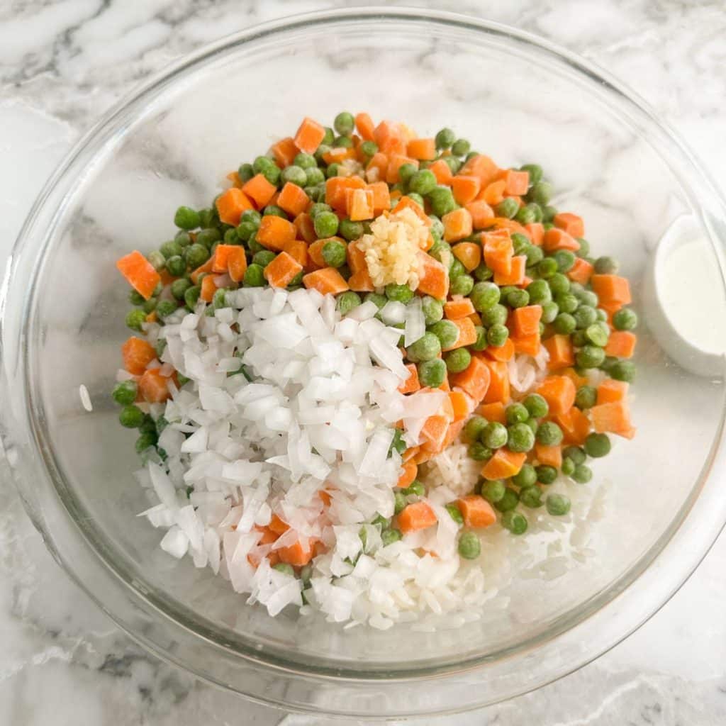Bowl with rice, peas, and carrots.
