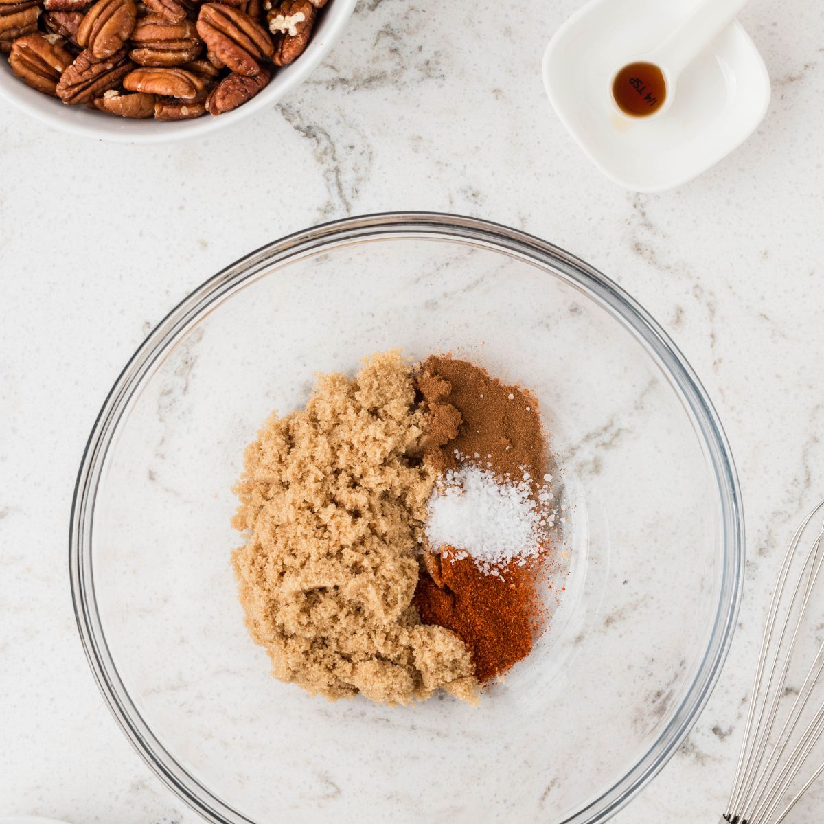 Bowl of brown sugar, cinnamon, salt, and cayenne. 