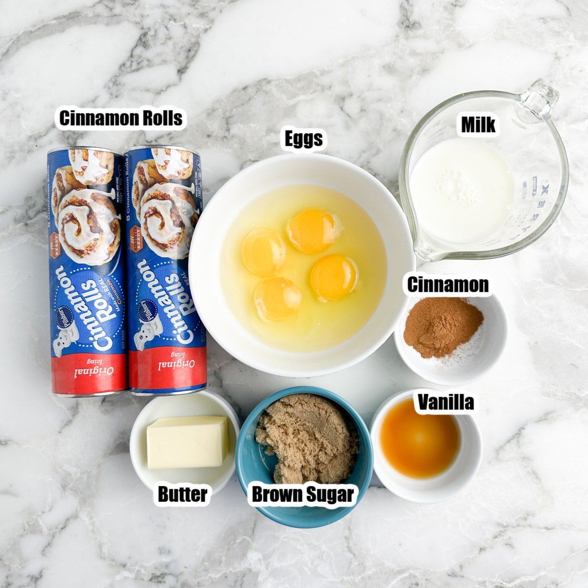 Canned cinnamon rolls, bowl of eggs, milk, brown sugar, and cinnamon. 