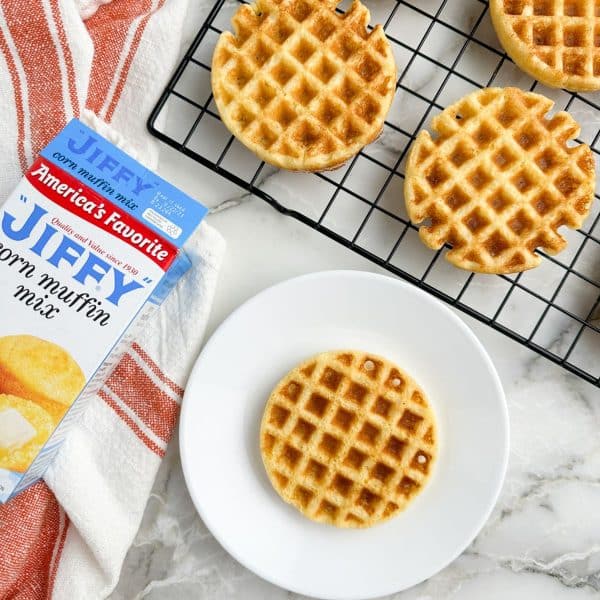 Mini waffles on a plate and cooling wrack.