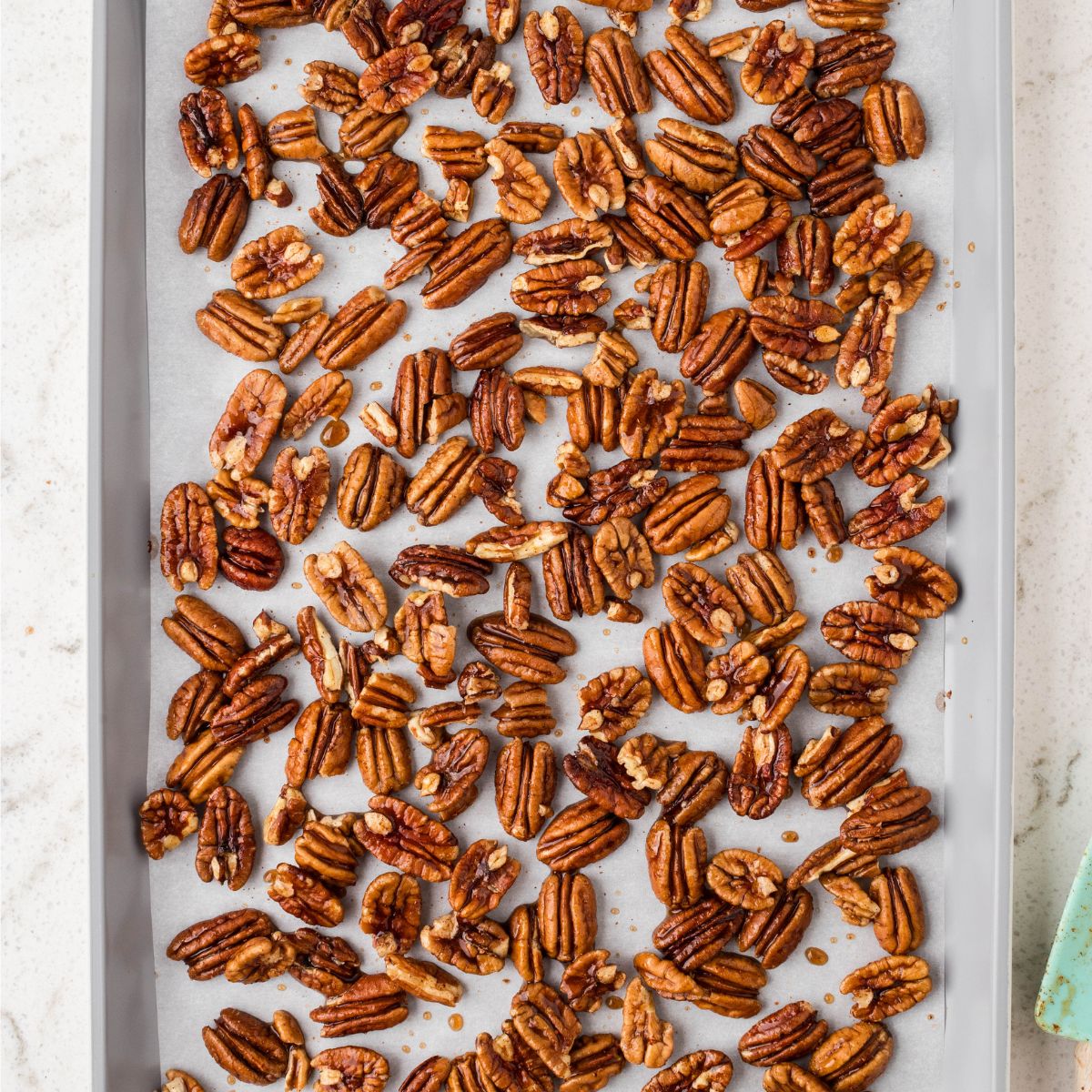 Pecans on a baking sheet. 