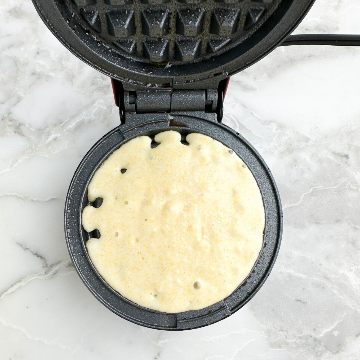 Batter in a waffle iron. 