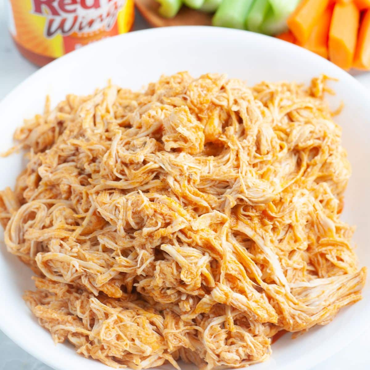 Shredded chicken in a bowl. 