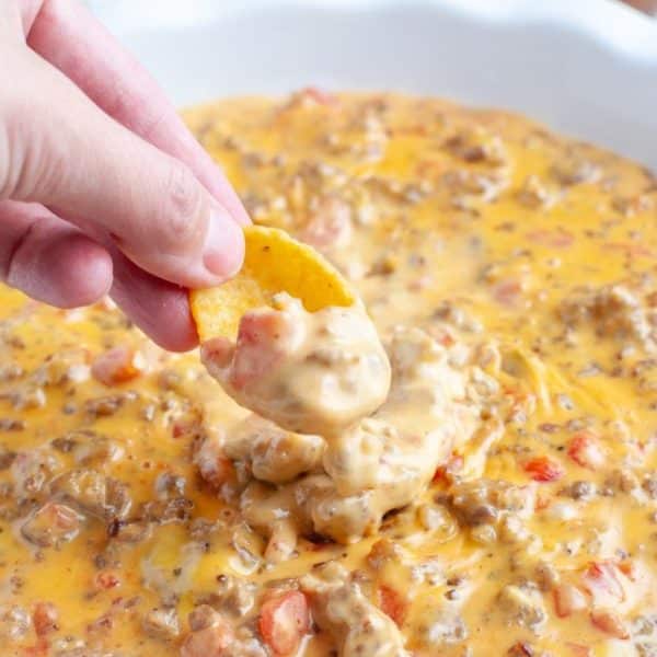 Sausage cheese dip on a corn chip.