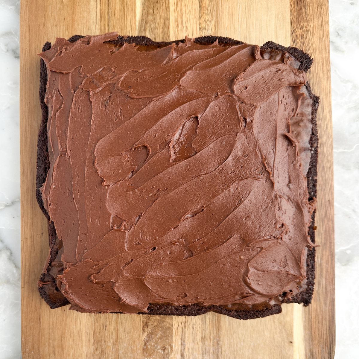Chocolate frosting on brownies. 