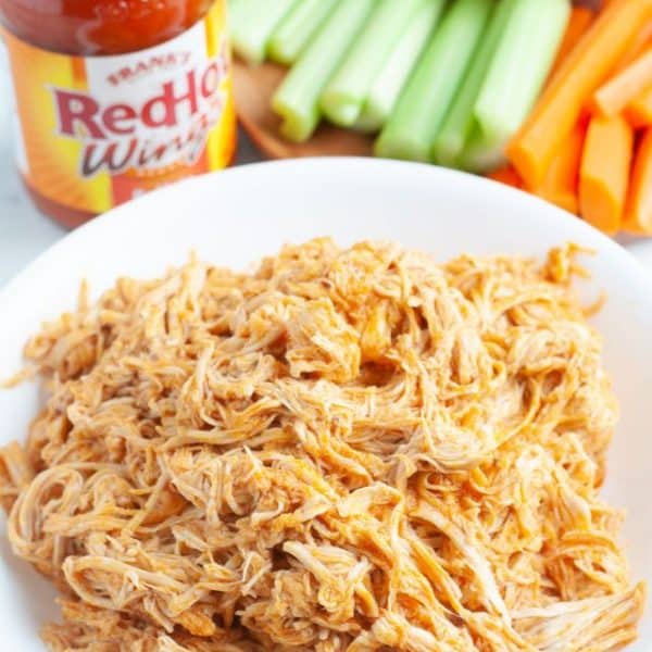 Bowl of shredded buffalo chicken.