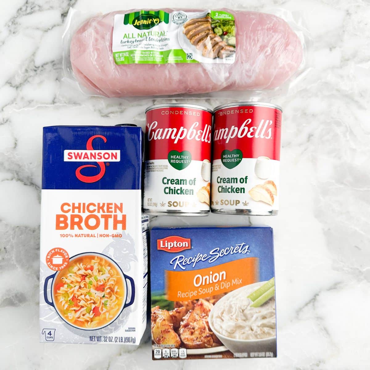 Box of chicken broth, cans of cream of chicken soup, turkey tenderloin, and onion soup mix.