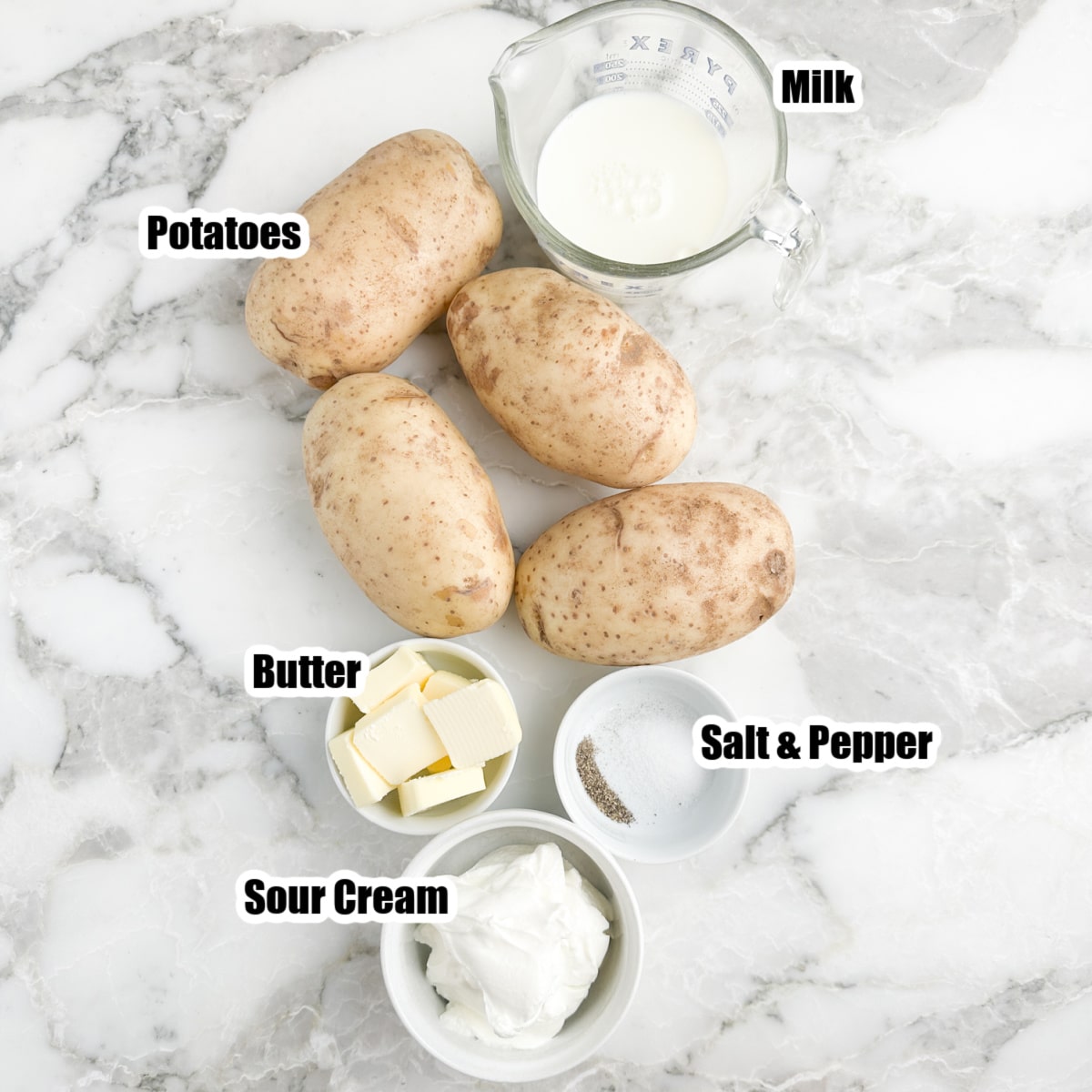Bowl of milk, potatoes, butter, and sour cream. 