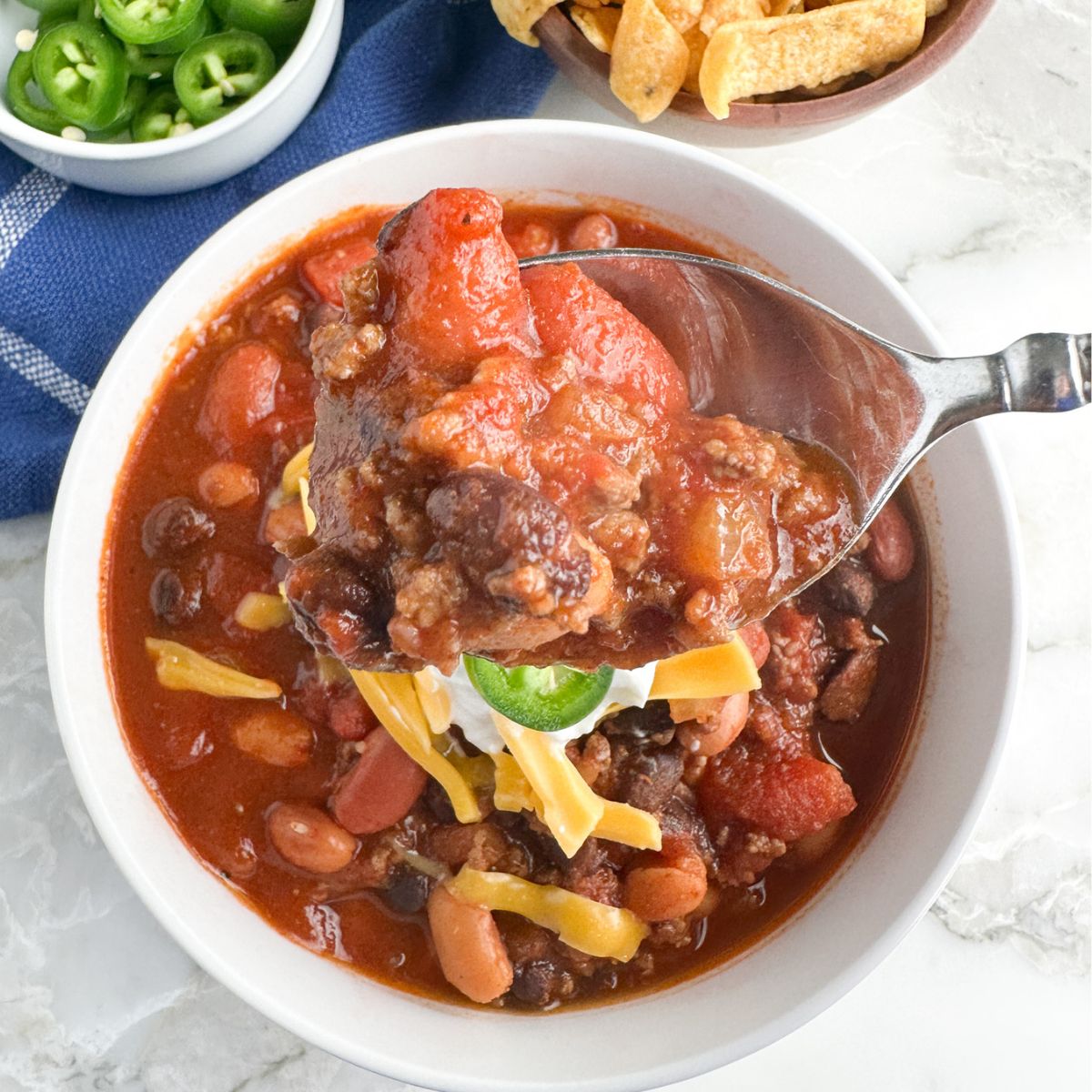 Bowl with chili and a spoon.