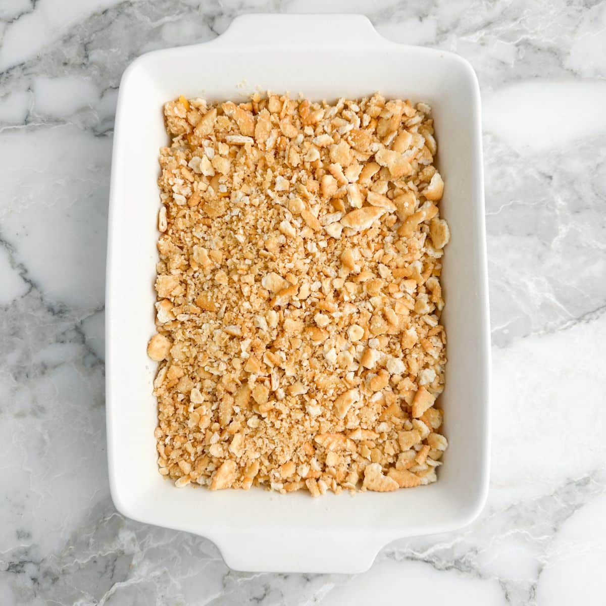 Casserole dish with cracker crumbs. 