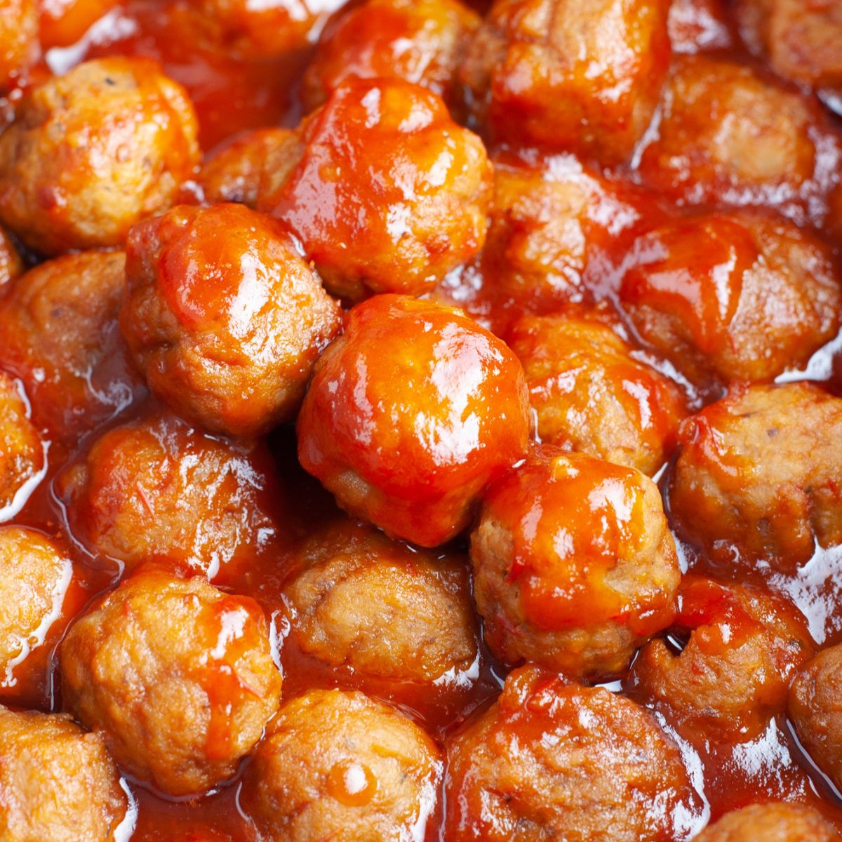 Meatballs covered in sauce. 