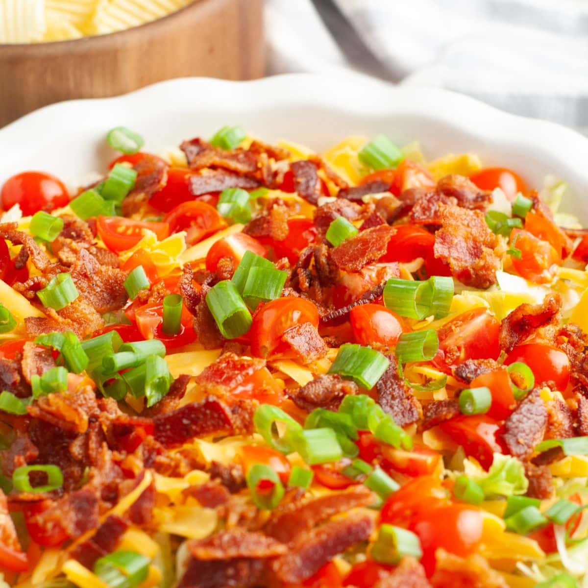 Pie plate with bacon and tomato dip.