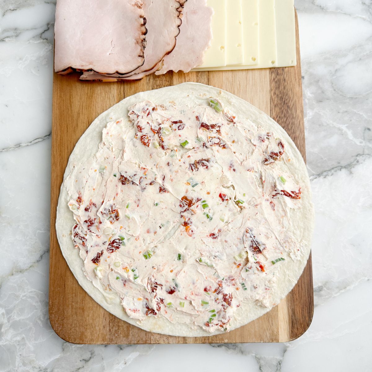 Tortilla with a cream cheese spread. 