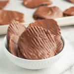 Chocolate covered potato chips in a bowl.