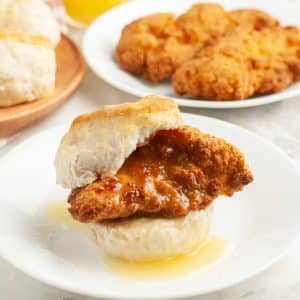 Biscuit with chicken tender and honey.