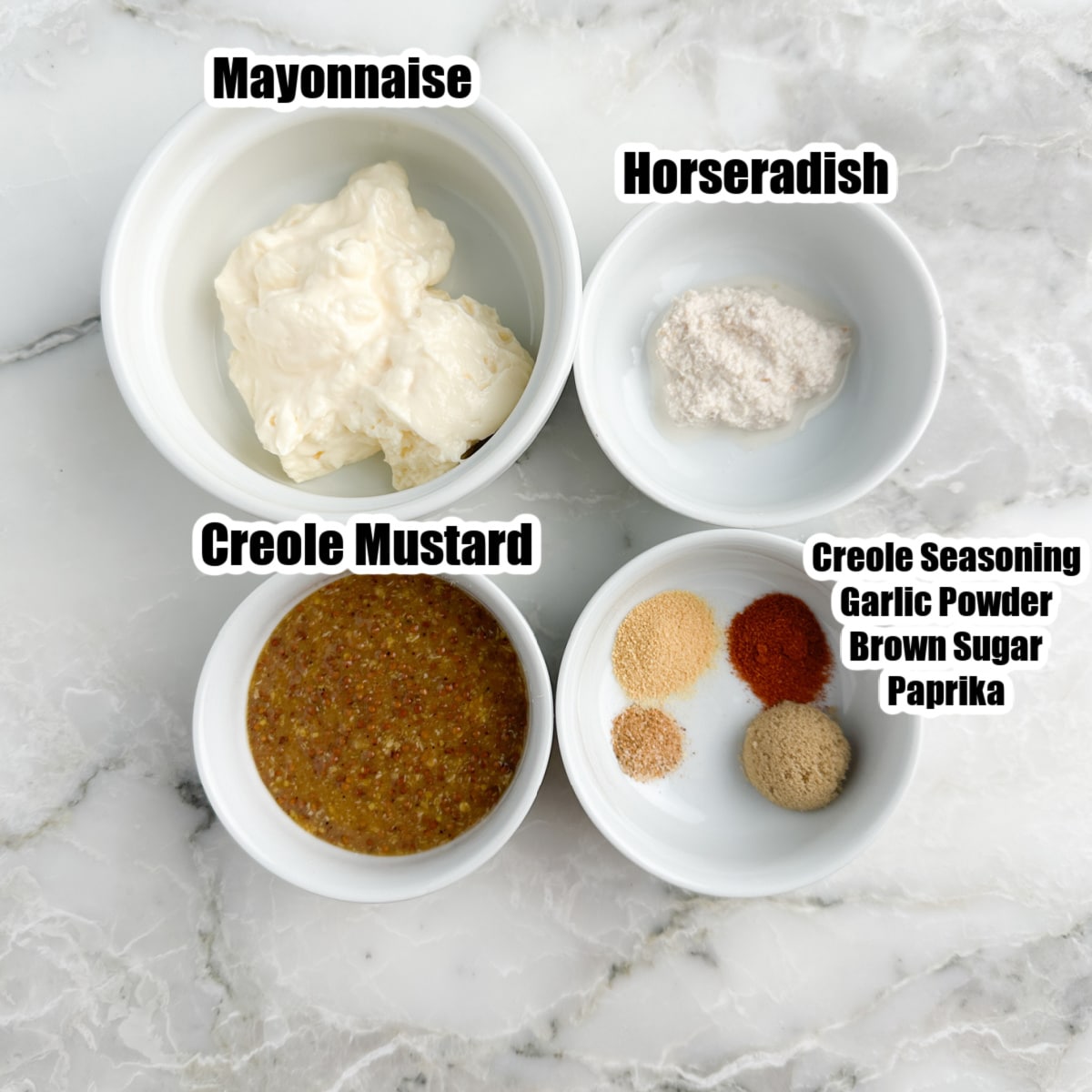 Bowl of mayonnaise, mustard, horseradish, and seasonings.