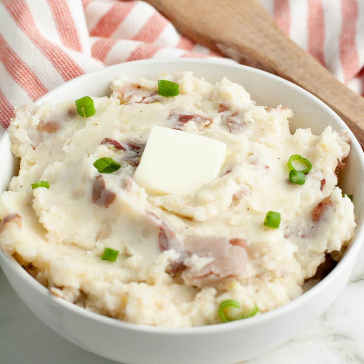 Bowl of mashed potatoes with butter. 
