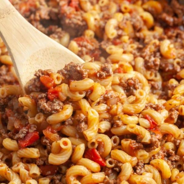 Macaroni and ground beef in a skillet.