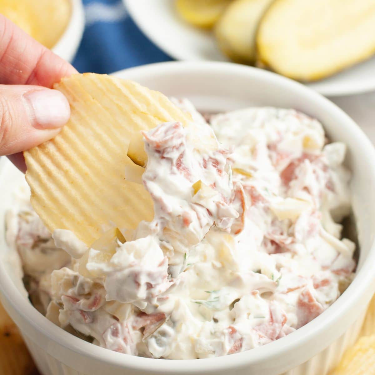 Potato chip with cream cheese dip. 