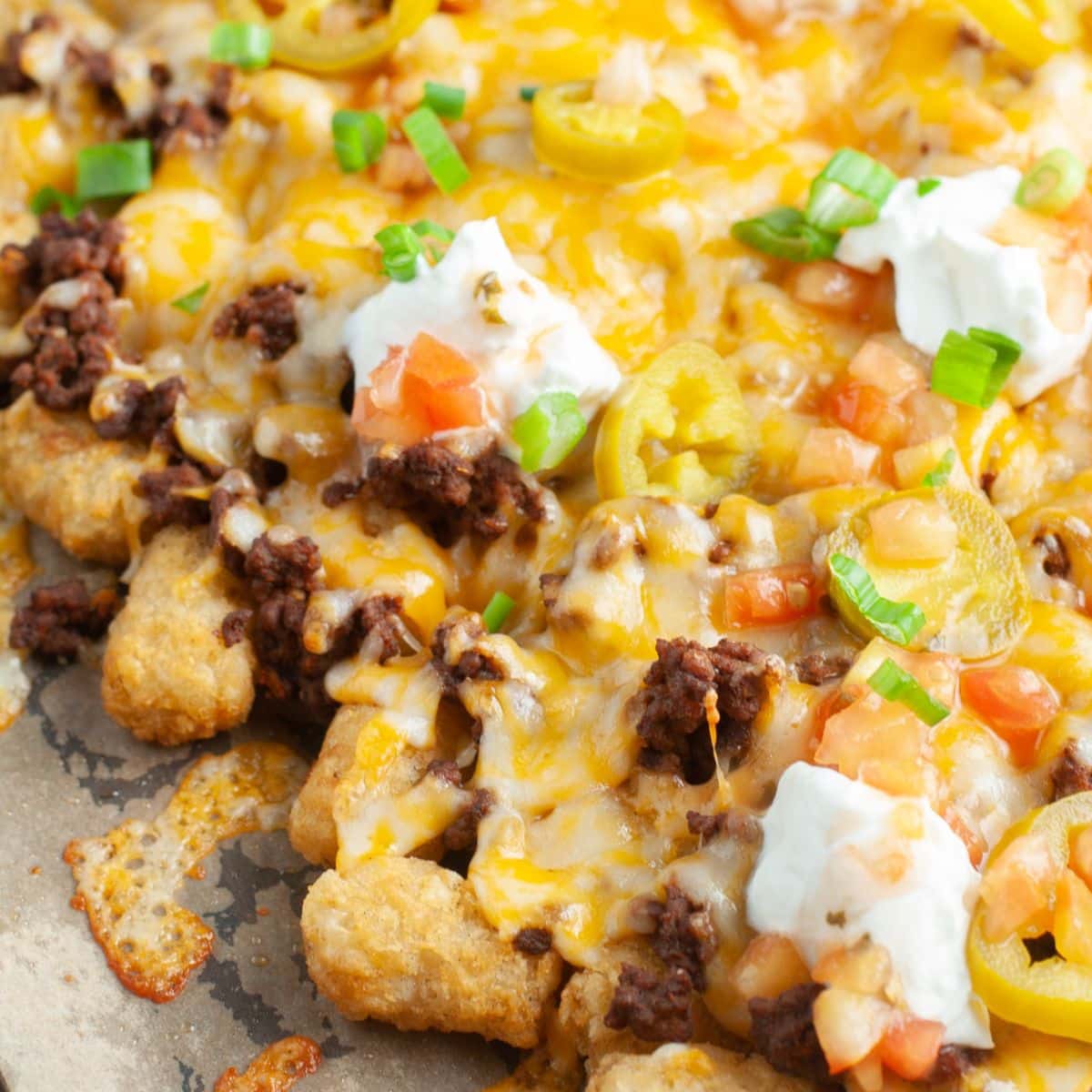 Tater tot nachos on a baking sheet. 