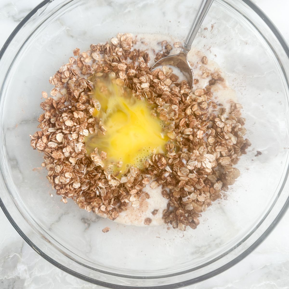 Bowl with oats, milk, and eggs. 