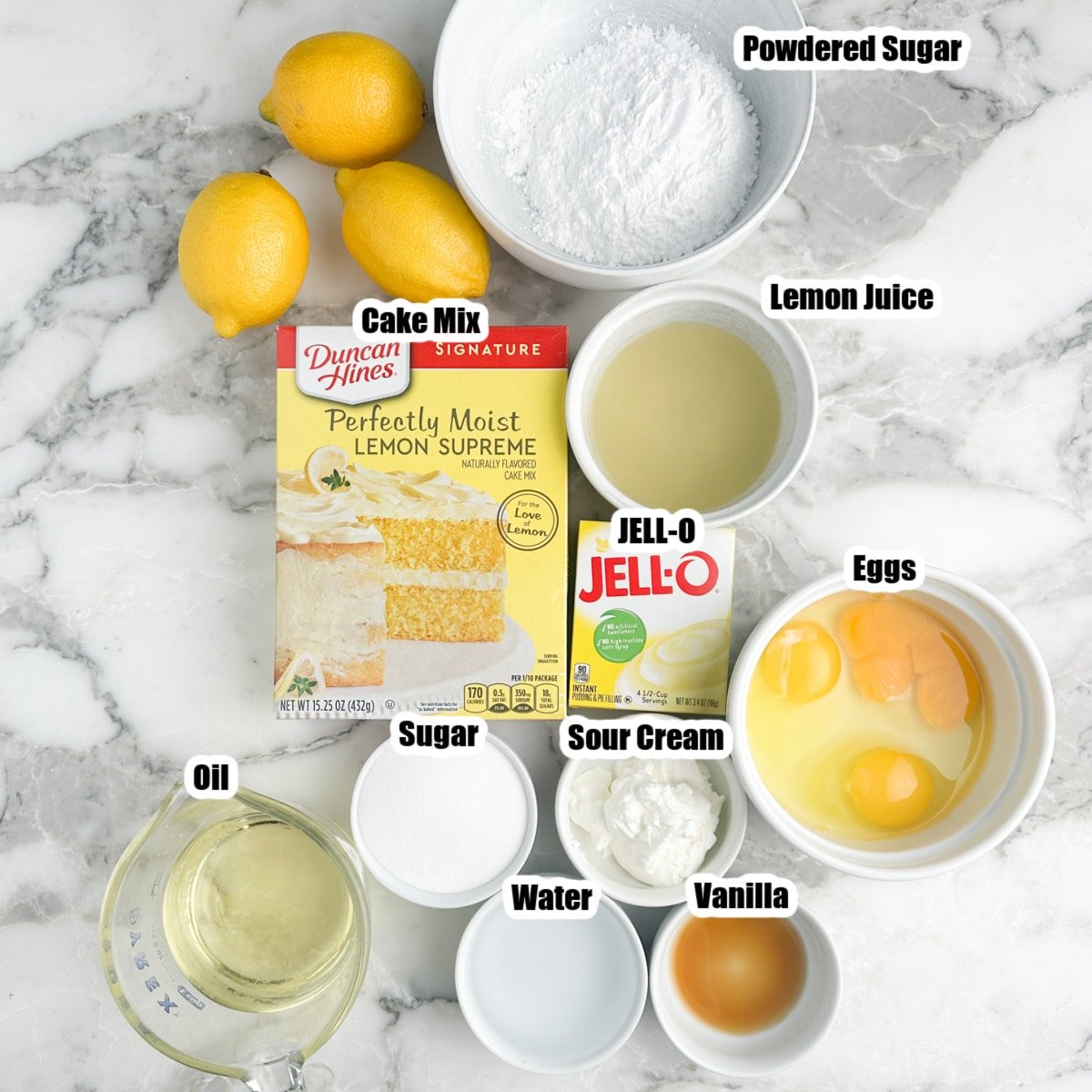 Box of lemon cake mix, pudding, bowl of powdered sugar, lemon juice, eggs, oil, and sugar. 