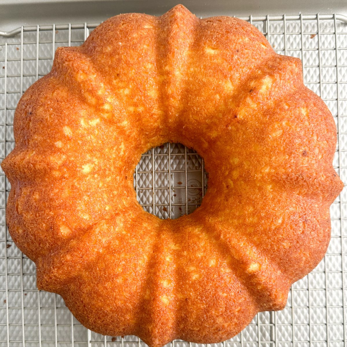 Bundt cake on a cooling rack. 