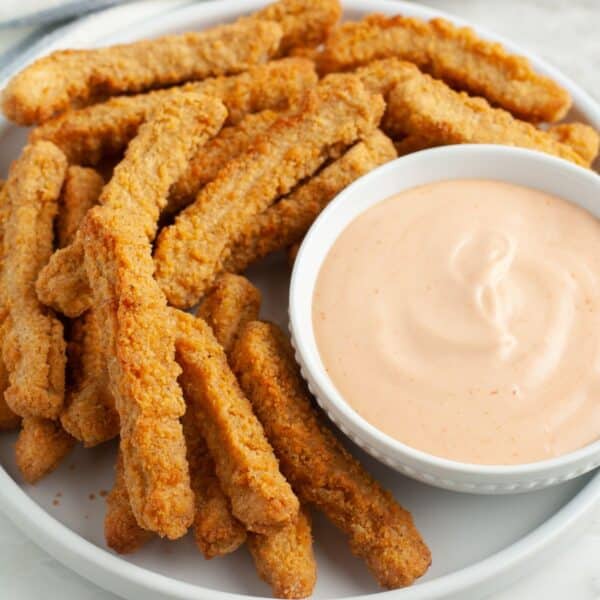 Plate with chicken fries and a bowl of dipping sauce.