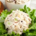 Scoop of chicken salad on a bed of lettuce.