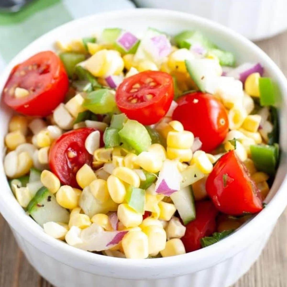 Bowl with corn and tomato salad.