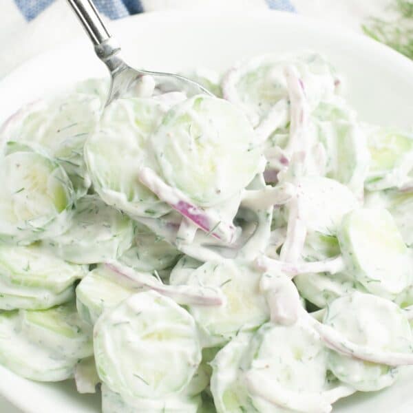 Spoon with cucumber and onion salad.