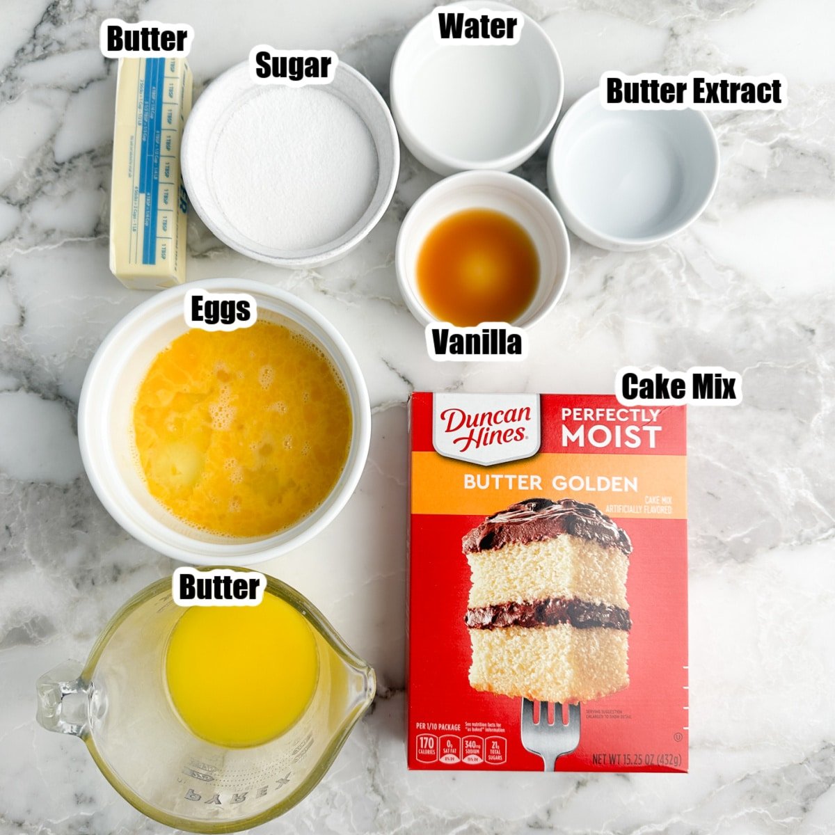 Box of cake mix, bowl of eggs, melted butter, sugar, vanilla, and water. 