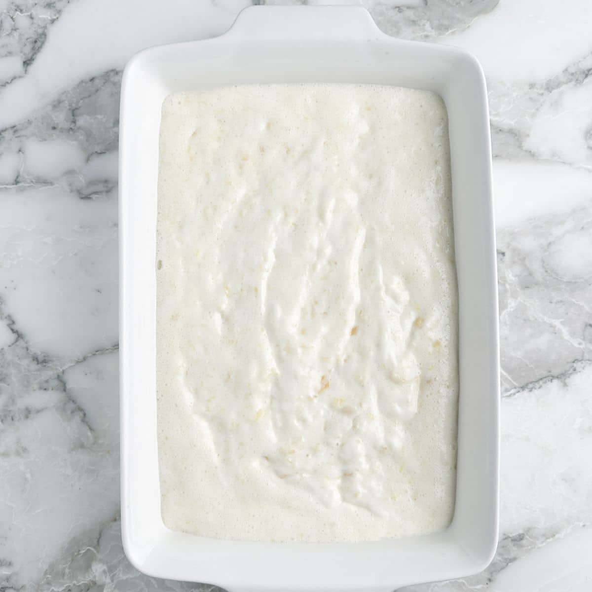 Baking dish with angel food cake batter.