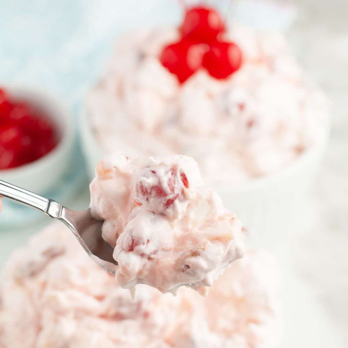 Spoon with cherry fluff.