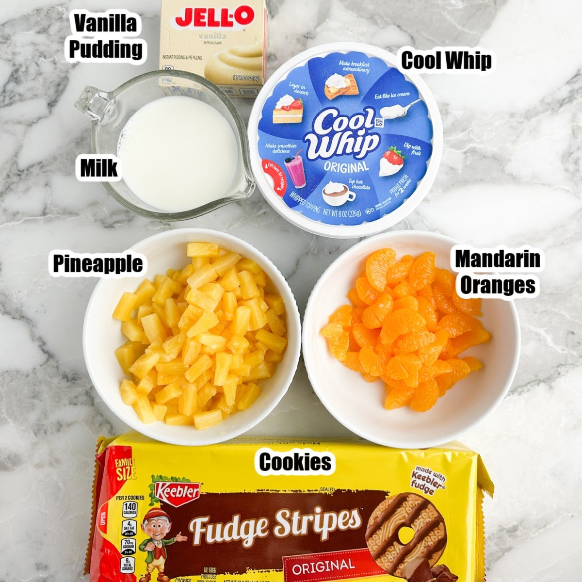 Vanilla pudding, milk, Cool Whip, pineapple, oranges, and fudge striped cookies.