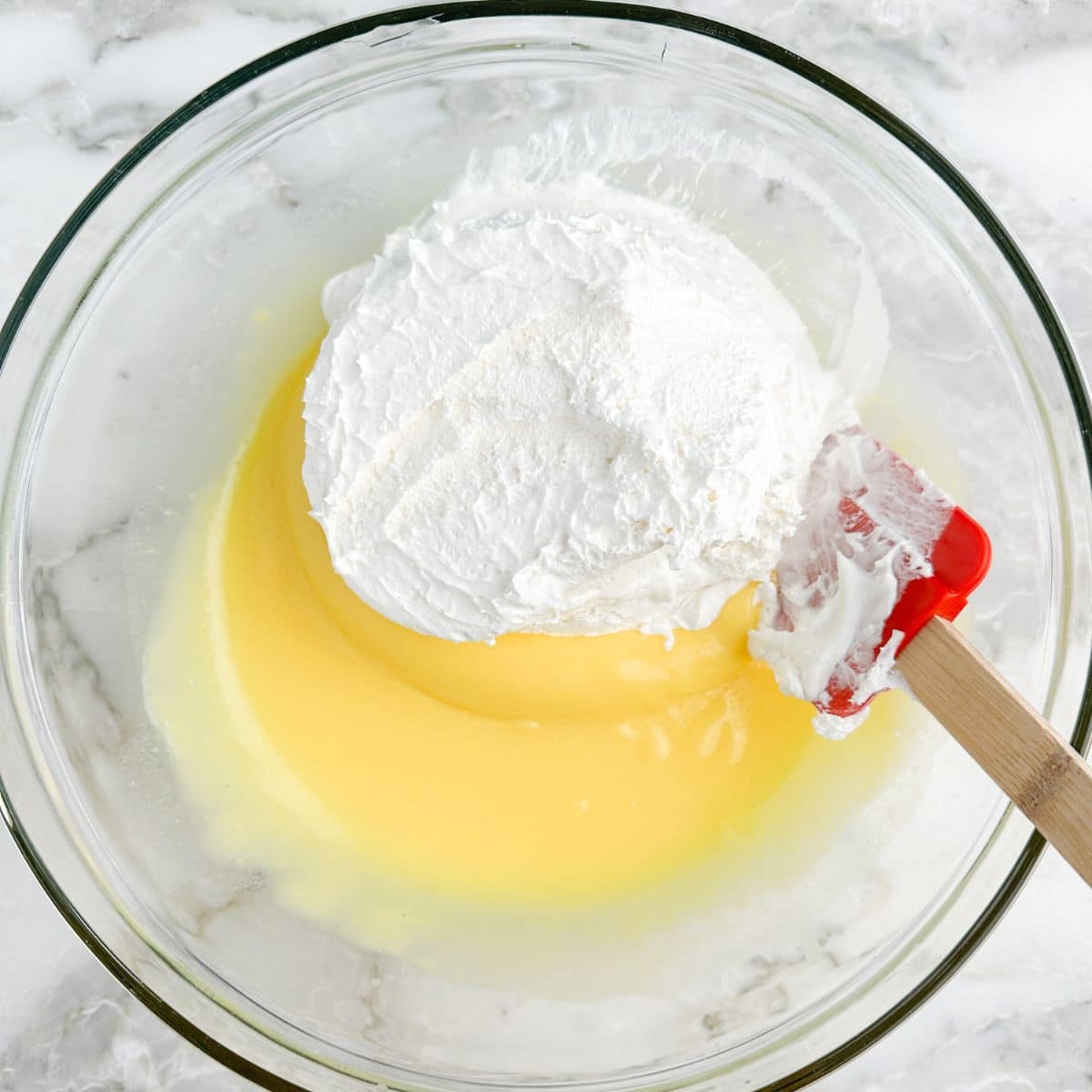 Bowl with vanilla pudding and Cool Whip.