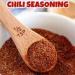 Bowl with a spoon of homemade chili seasoning mix.