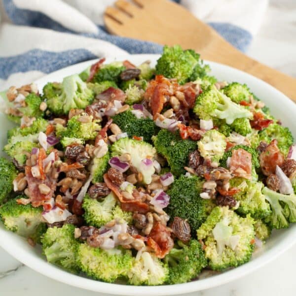 Bowl of broccoli salad with raisins.