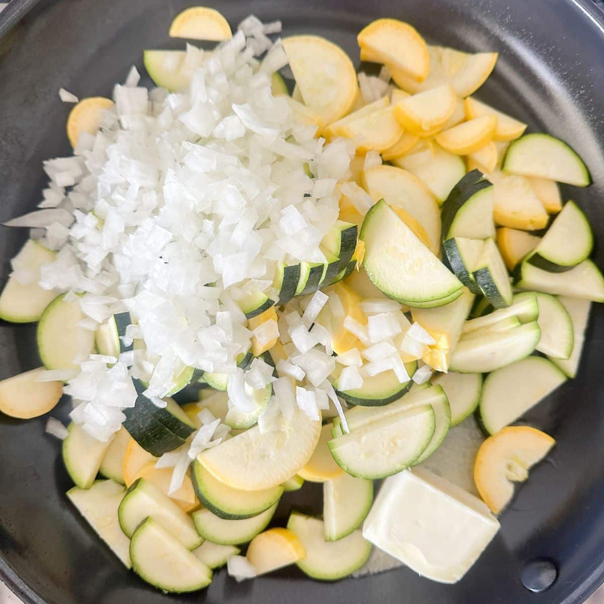 Skillet with zucchini, squash, and onions.